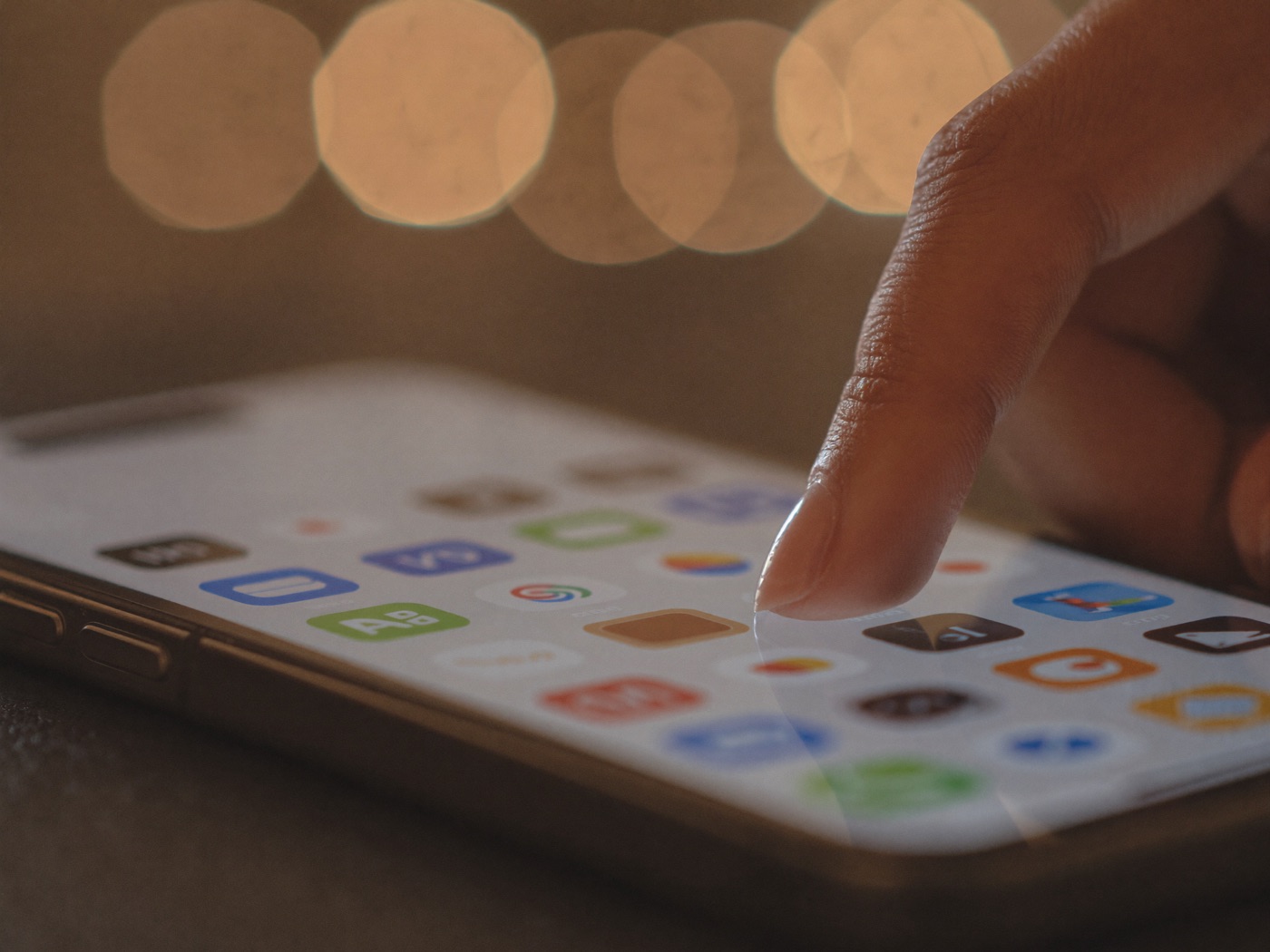 A thumb tapping the call button on a business website